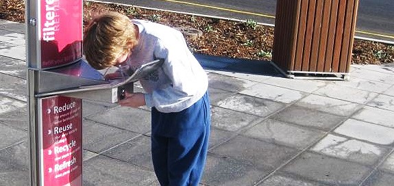 kid at drinking fountain